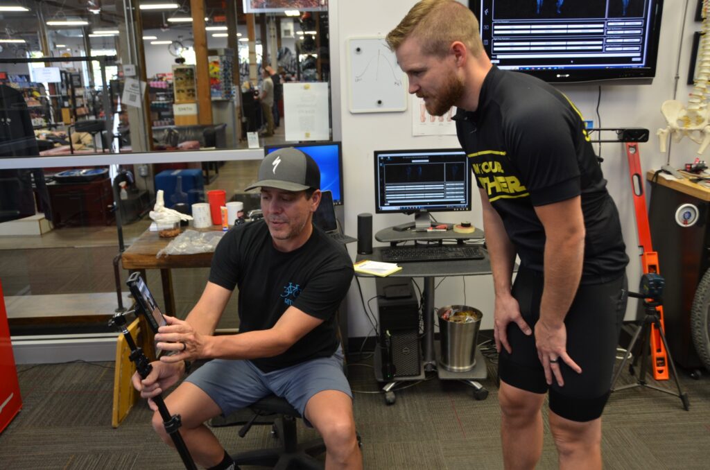 Ben Stein working with an athlete during a bike fitting and biomechanics assessment.
